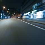 Motion blurred urban city road at night streetlit backplate