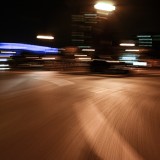 Motion blurred urban city road at night streetlit backplate