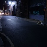 Urban side road at night streetlit moody with graffiti backplate for HDRi map